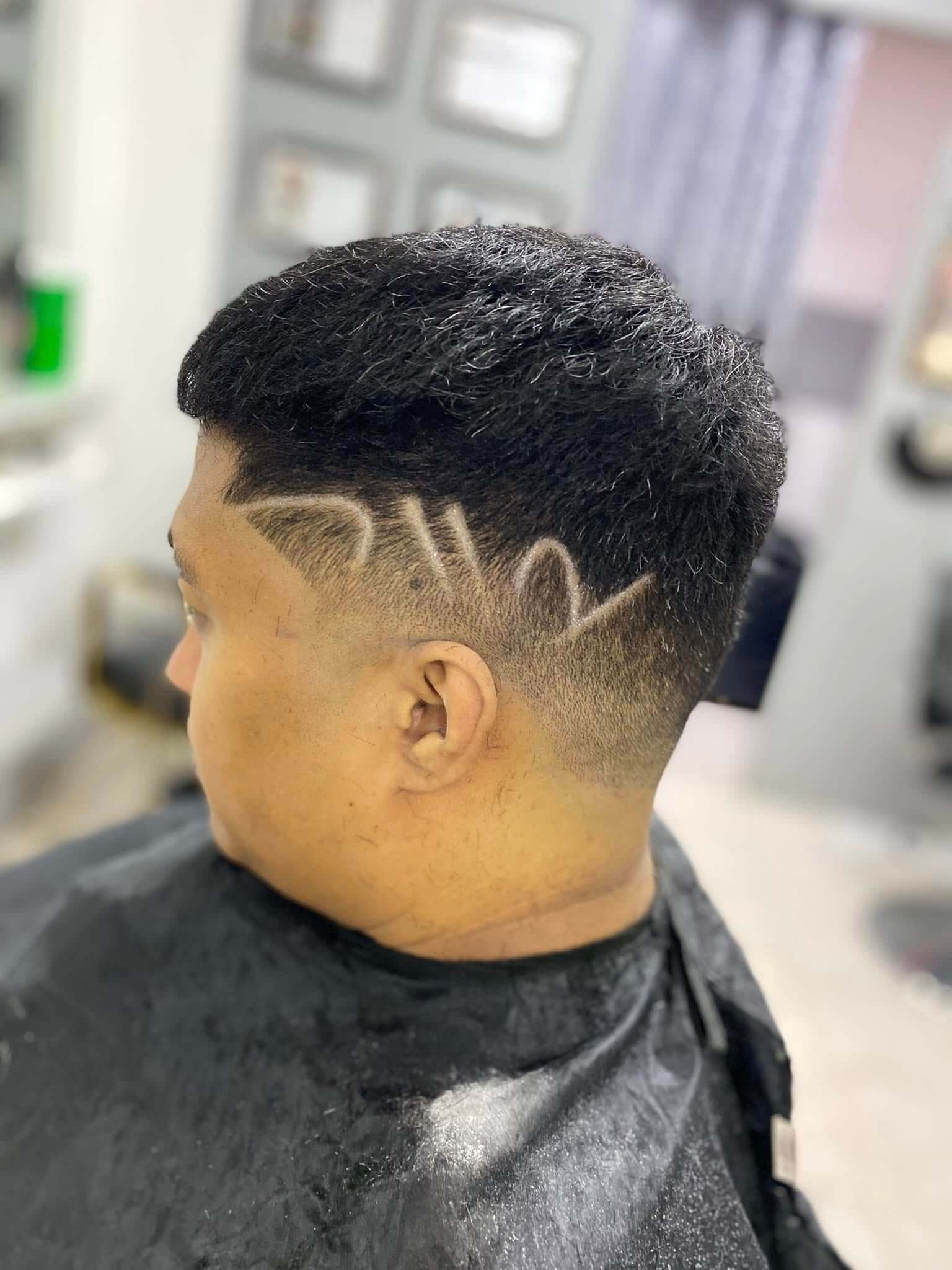 Textured men's hairstyle with volume and precision side taper